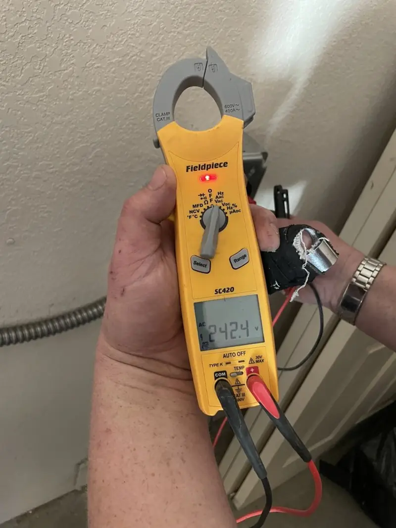 Voltage testing with clamp meter during Circuit Breaker Repair in Meridian Village
